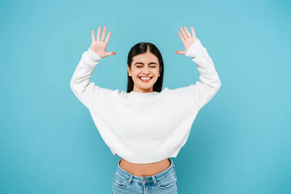 Smiling Pretty Girl White Sweater Showing Hands Isolated Blue — Stock Photo, Image