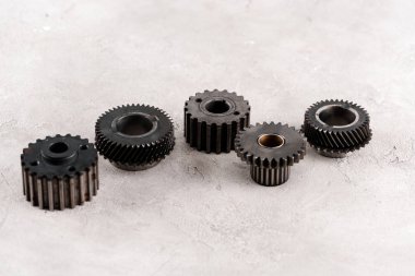 metal round gears on grey background clipart