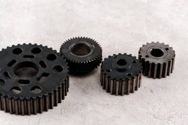 metal round gears on grey background clipart