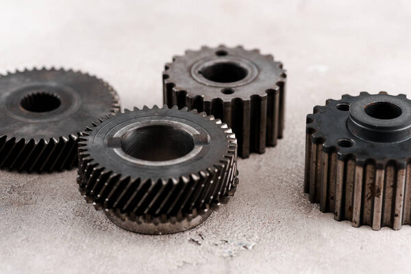 metal round gears on grey background