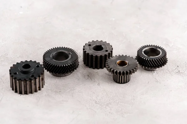 metal round gears on grey background