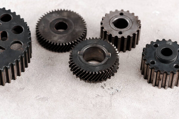 metal round gears on grey background