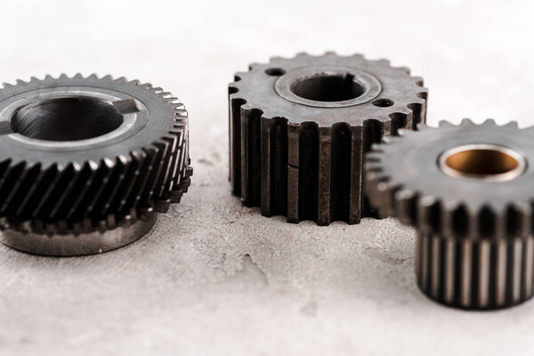 metal round gears on grey background