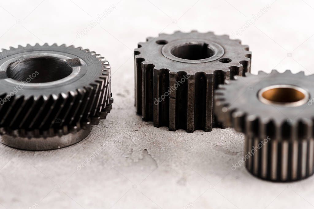 metal round gears on grey background