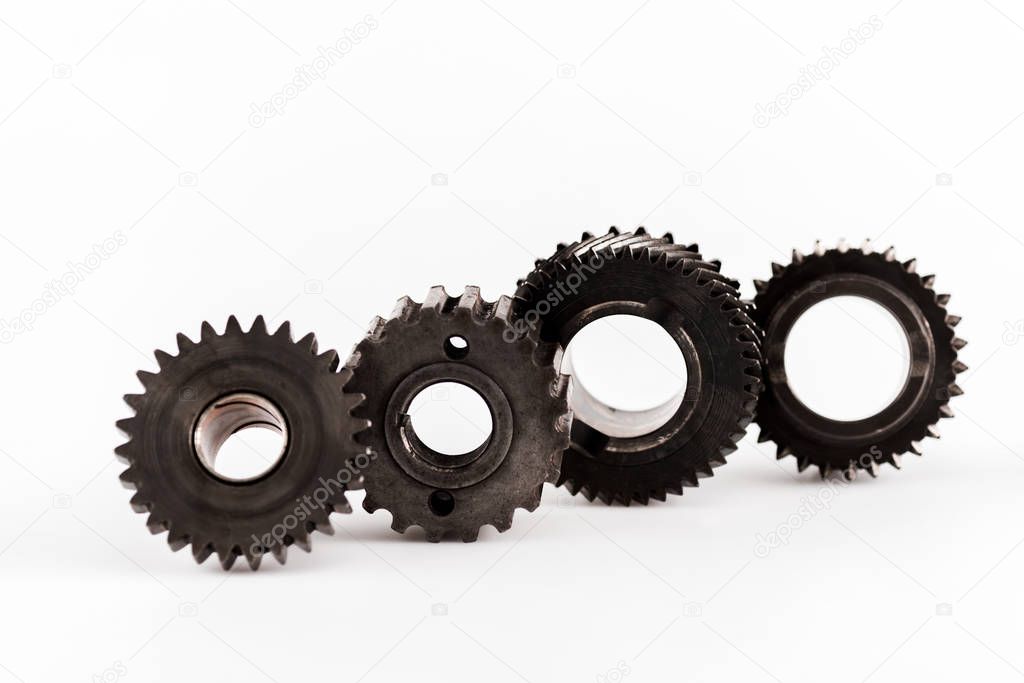 metal round gears in row on white background