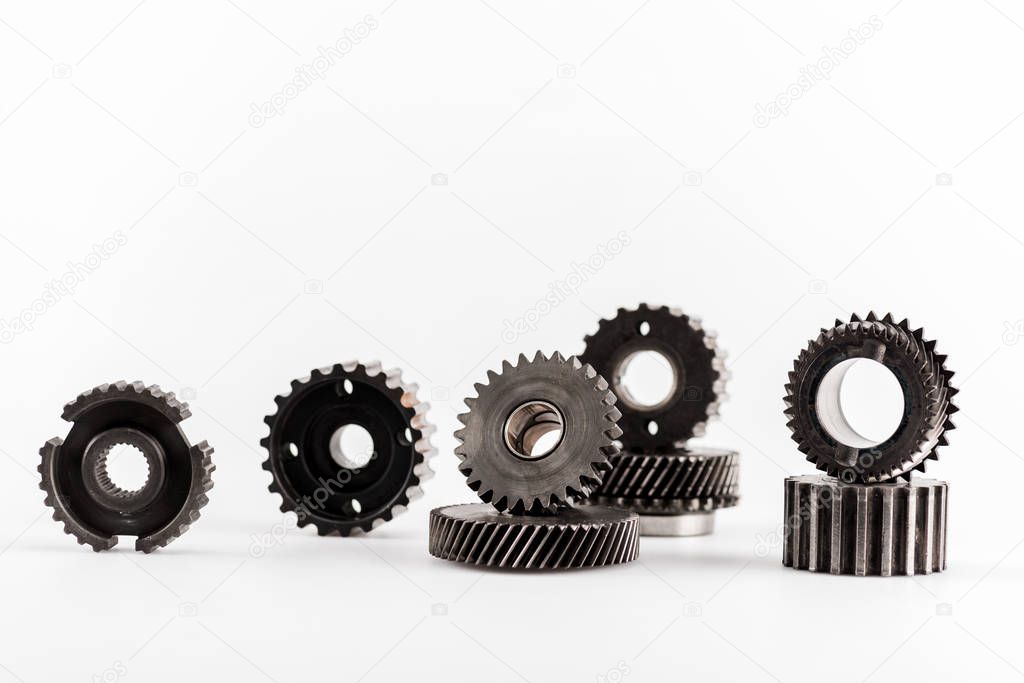metal round gears on white background with copy space