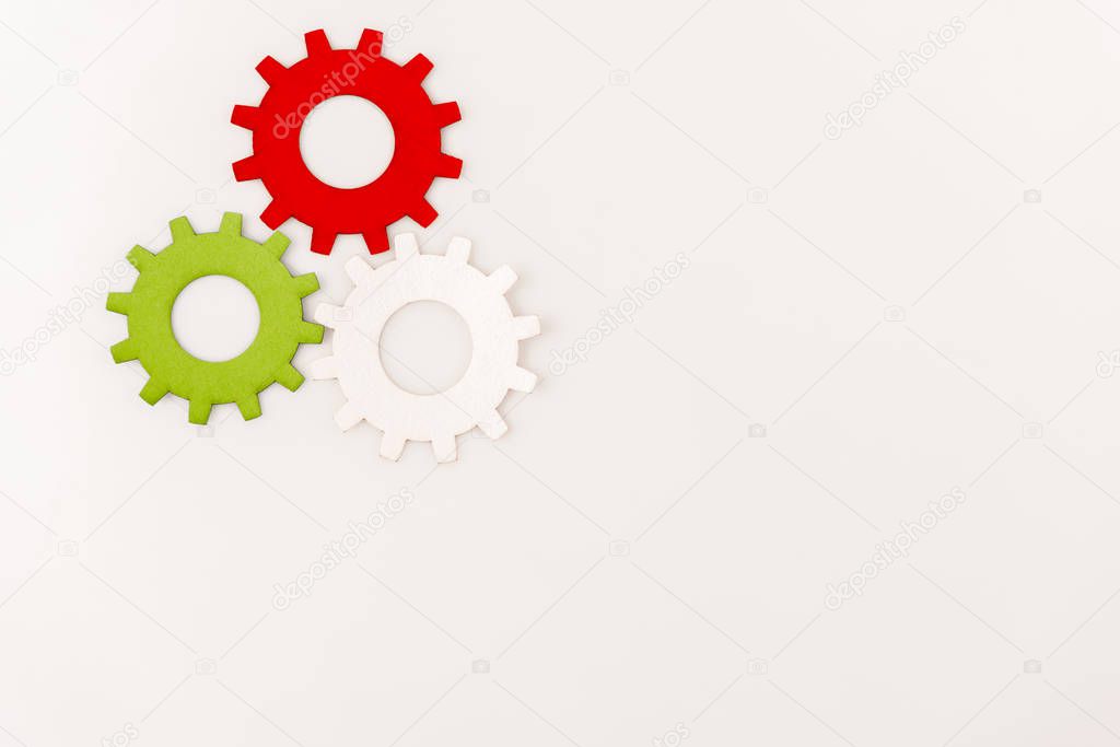 top view of colorful gears isolated on white