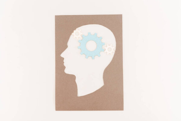 top view of human head silhouette with blue gear isolated on white