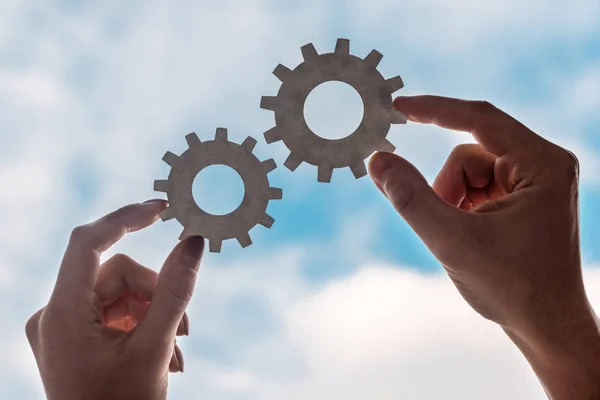 Cropped View Man Woman Holding Gears Blue Sky Background — Stock Photo, Image