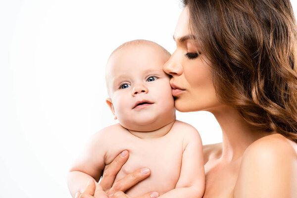 portrait of naked mother kissing baby, isolated on white