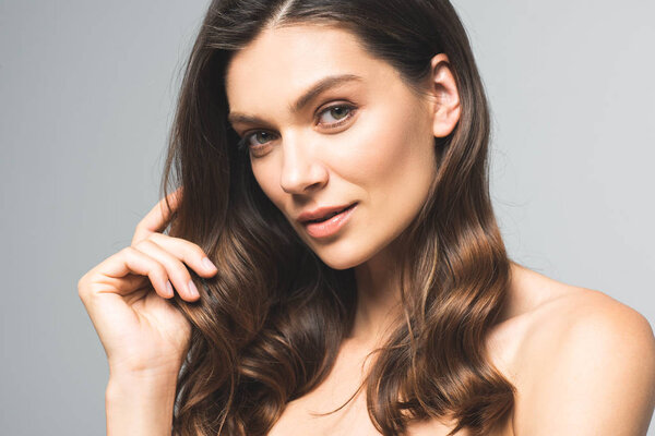 portrait of naked brunette girl with perfect skin, isolated on grey