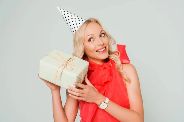 Smiling Curious Woman Shaking Gift Box Isolated Grey — Stock Photo, Image