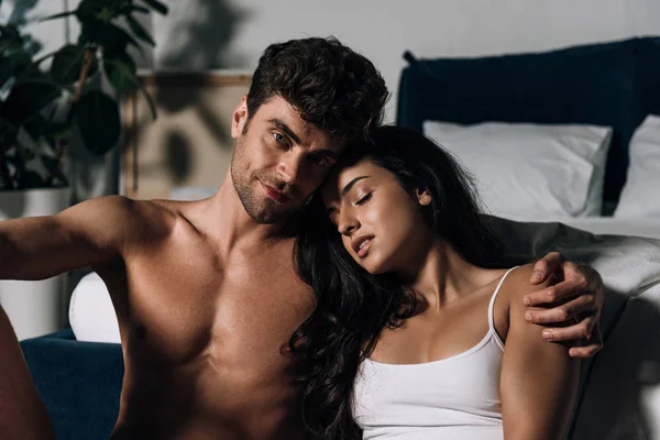 Happy Sexy Man Looking Camera While Hugging Beautiful Girlfriend Bed — Stock Photo, Image