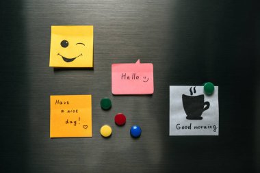 notes with wishes and magnets hanging on fridge clipart