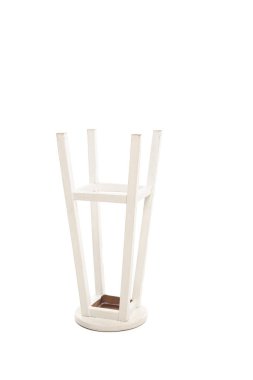 Turned white wooden stool isolated on white clipart