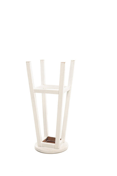 Turned white wooden stool isolated on white