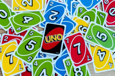 KYIV, UKRAINE - NOVEMBER 22, 2019: top view of playing card with uno letters clipart
