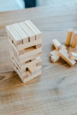 KYIV, UKRAINE - NOVEMBER 22, 2019: selective focus of wooden blocks stack game on table  clipart