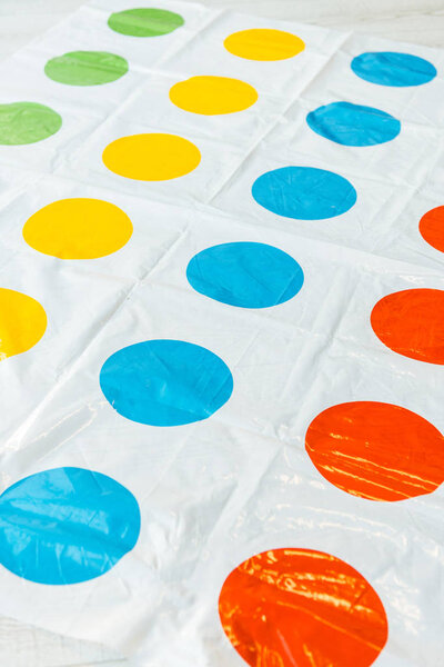 KYIV, UKRAINE - NOVEMBER 22, 2019: selective focus of twister game with colorful circles 