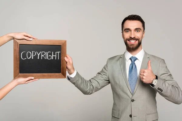 Cropped View Woman Holding Chalkboard Copyright Inscription Businessman Showing Thumb — Stock Photo, Image