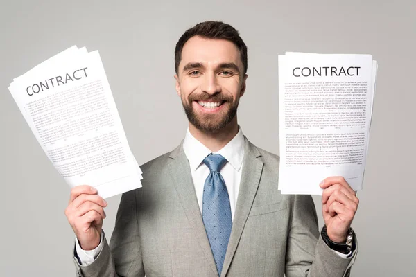 Happy Businessman Holding Contracts Looking Camera Isolated Grey — 스톡 사진