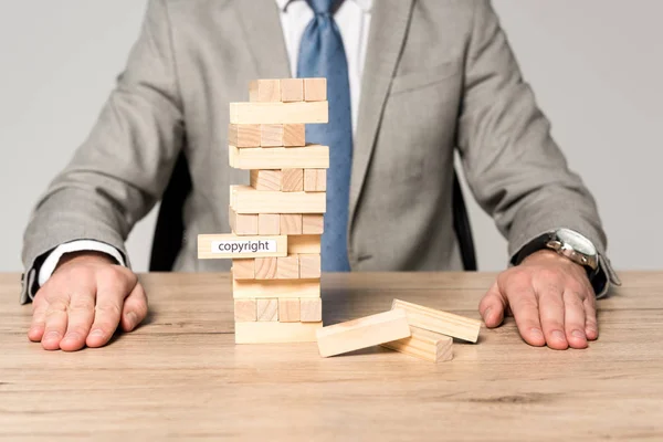 Partial View Businessman Blocks Wood Tower Game Copyright Inscription Isolated — Stock Photo, Image