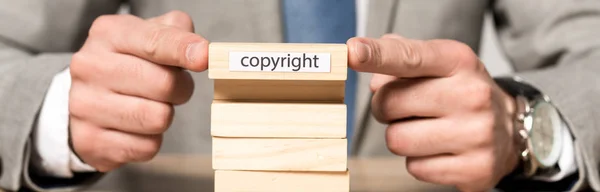 Cropped View Businessman Holding Wooden Block Copyright Inscription Isolated Grey — Stock Photo, Image