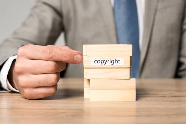 Partial View Businessman Blocks Wood Tower Game Copyright Inscription Isolated — Stock Photo, Image