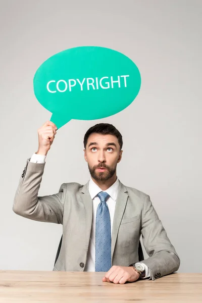 Surprised Businessman Holding Thought Bubble Word Copyright Isolated Grey — Stock Photo, Image