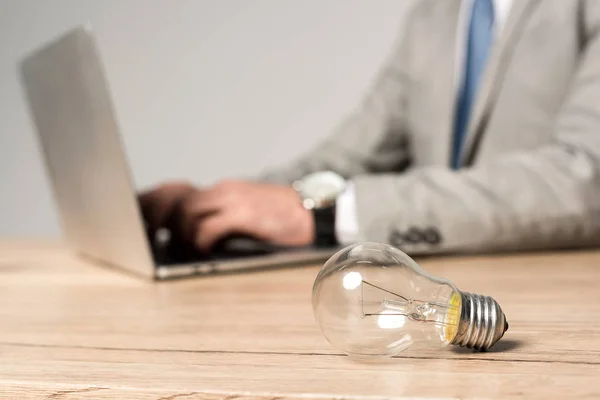Partial View Businessman Using Laptop Workplace Light Bulb Isolated Grey — Stock Photo, Image