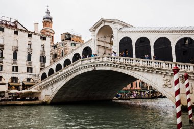 VENICE, ITALY - SEPTEMBER 24, 2019: ancient Rialto Bridge and grand canal in Venice, Italy  clipart