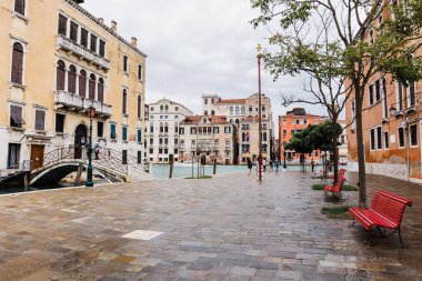 VENICE, ITALY - SEPTEMBER 24, 2019: bridge, canal and ancient buildings in Venice, Italy  clipart