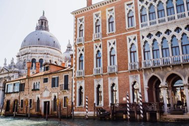 Santa Maria della Salute church and ancient building in Venice, Italy  clipart