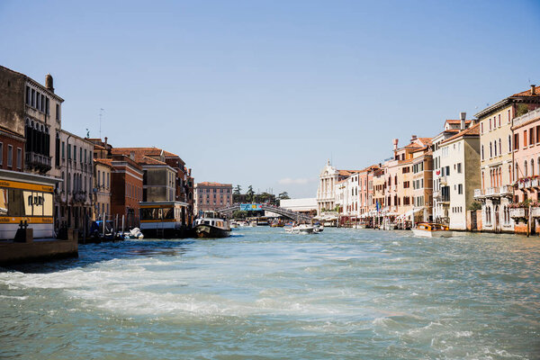 VENICE, ITALY - SEPTEMBER 24, 2019: motor boats floating on grand canal in Venice, Italy 