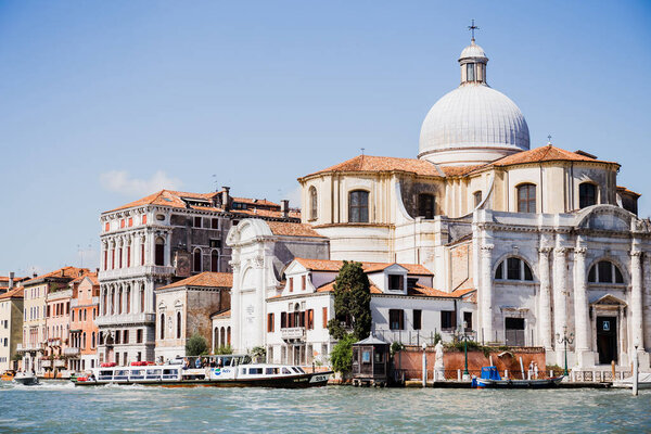 VENICE, ITALY - SEPTEMBER 24, 2019: canal with vaporettos near Santa Maria della Salute in Venice, Italy 