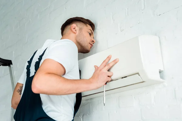 Handsome Worker Installing Air Conditioner — 스톡 사진