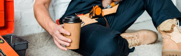 Panoramic Shot Installer Sitting Carpet While Holding Paper Cup — Stock Photo, Image