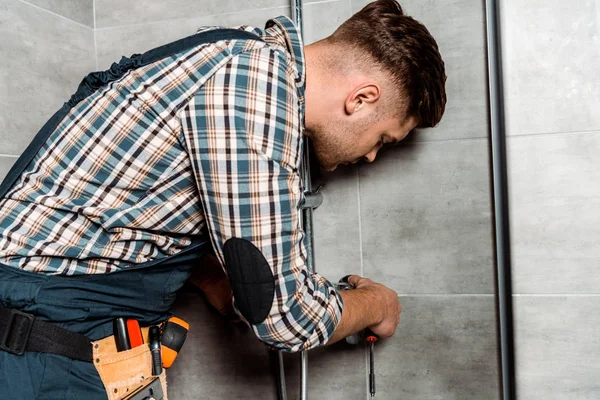Serious Installer Overalls Standing Bathroom Pipe — Stock Photo, Image