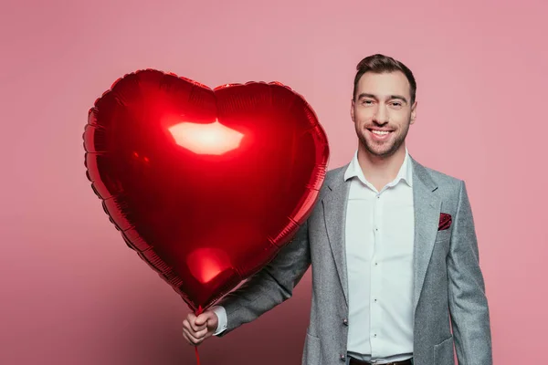 Bearded Smiling Man Holding Red Heart Balloon Isolated Pink — Stockfoto