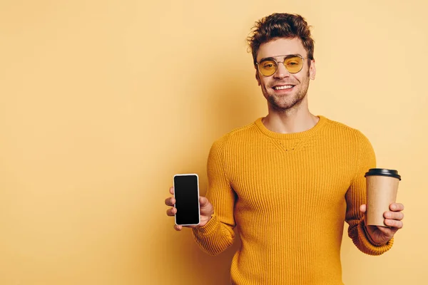 Handsome Man Showing Smartphone Blank Screen While Holding Coffee Yellow — Stock Photo, Image