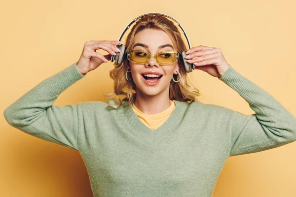 Cheerful Girl Glasses Listening Music Wireless Headphones Yellow Background — 스톡 사진