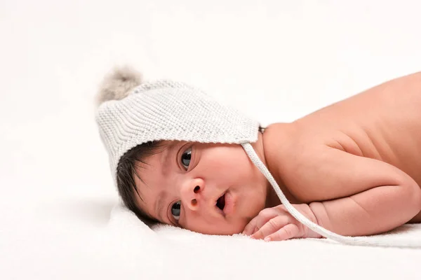 Cute Racial Newborn Baby Knitted Hat Lying White — Stock Photo, Image