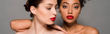 panoramic shot of attractive nude multiracial girls with red lips, isolated on grey
