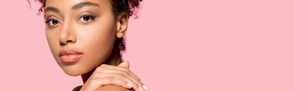 panoramic shot of beautiful african american girl with clean face, isolated on pink