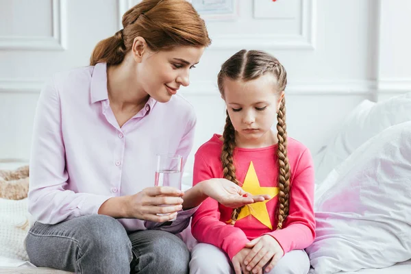 Smiling Mother Giving Pill Glass Water Ill Daughter — Stock Photo, Image