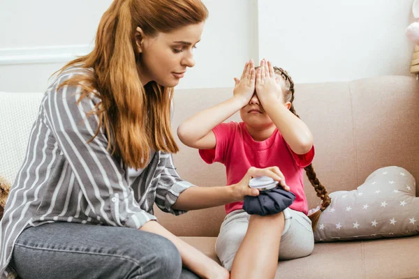 Mother Holding Ice Bag Compress Painful Knee Crying Daughter — Stock Photo, Image