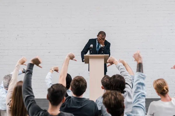 Back View Journalists Showing Thumbs African American Speaker Covering Face — Stock Photo, Image