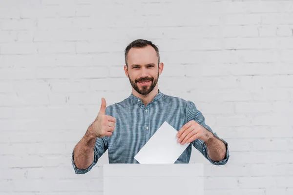 Cheerful Voter Showing Thumb While Holding Blank Ballot — Stock Photo, Image