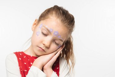 sleepy child with floral painting on face standing with closed eyes isolated on white clipart