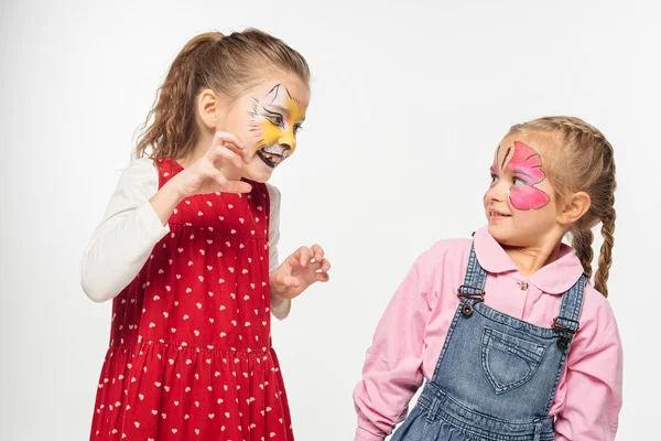 Cheerful Kid Cat Muzzle Painting Face Scaring Friend Isolated White — Stock Photo, Image